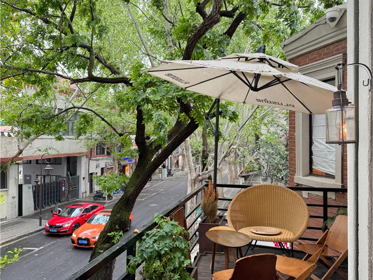 Cafe terrace on a tree-lined street in the Former French Concession, Shanghai