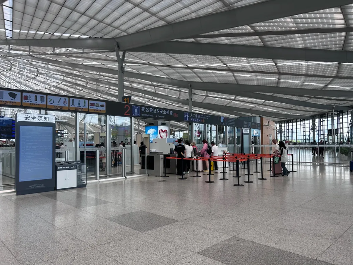 Passport holders use a manual lane at Chinese high-speed rail stations
