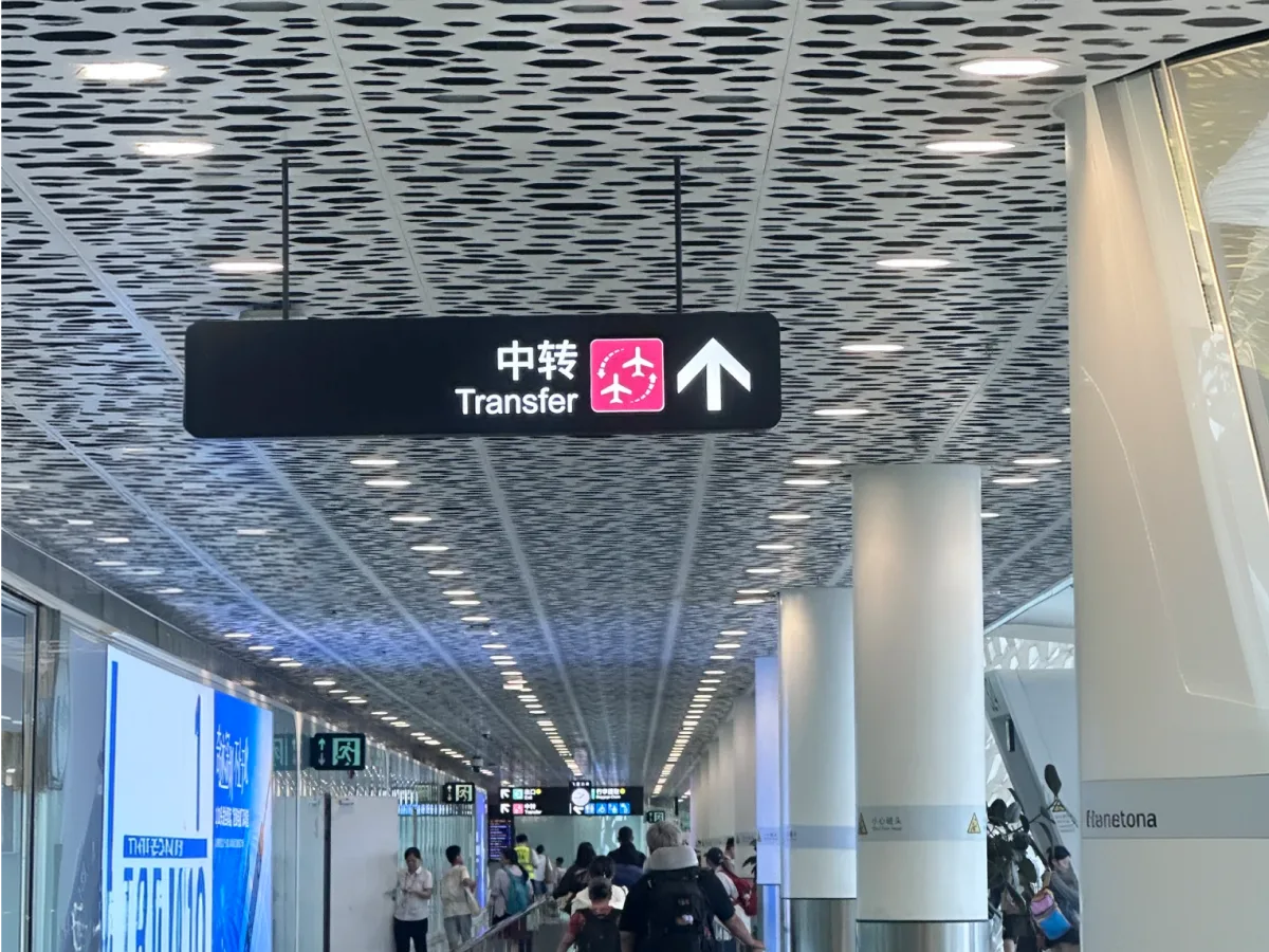 Third-country transit routing, not a US round-trip holiday